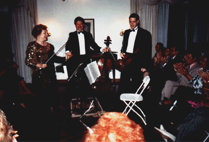 A warm reception in the Sala Casals for violinist Shirley Givens, violist Christian Colberg and cellist Harry Wimmer